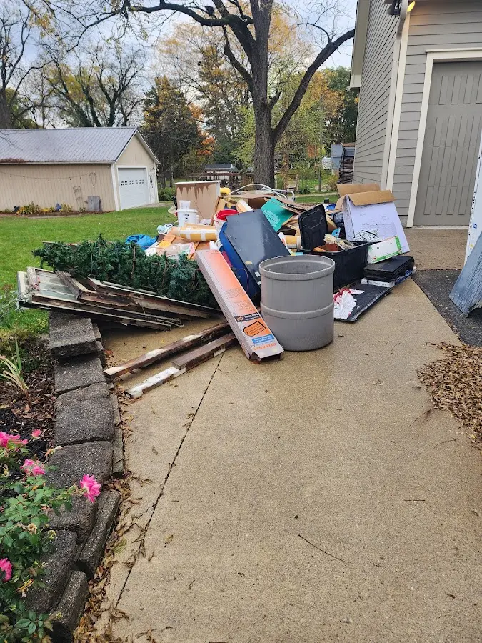 Dumpster being loaded with debris for Estate Cleanout Dumpster Rental in Sheffield